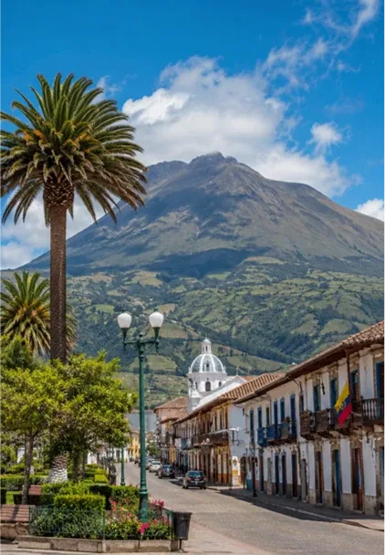 A quiet Cotacachi street with the volcano rising behind the town